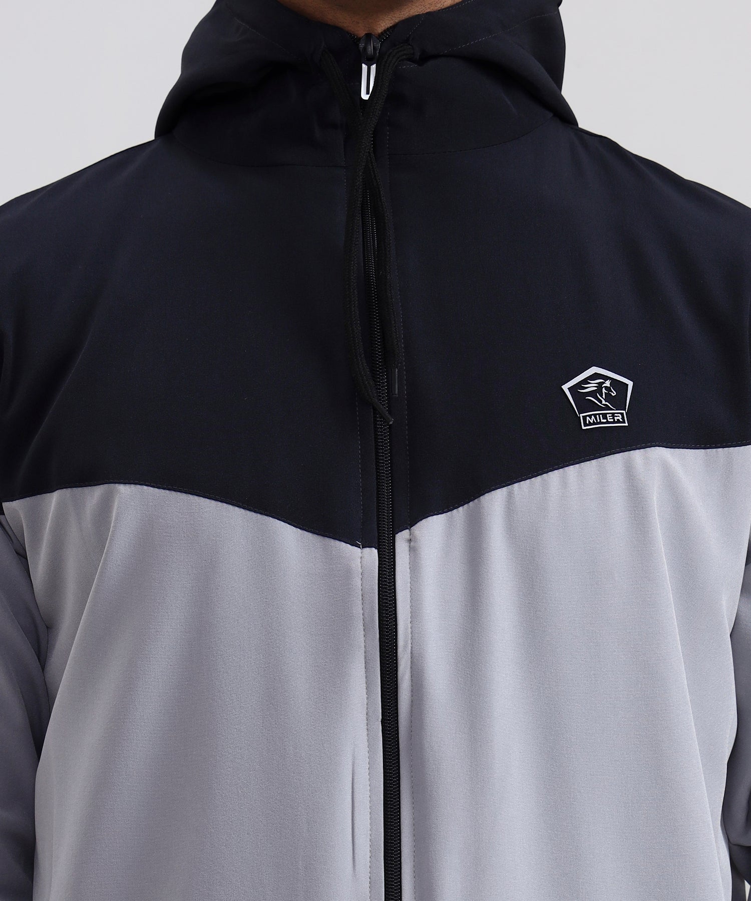 Men’s black and white casual hoodie photographed from behind